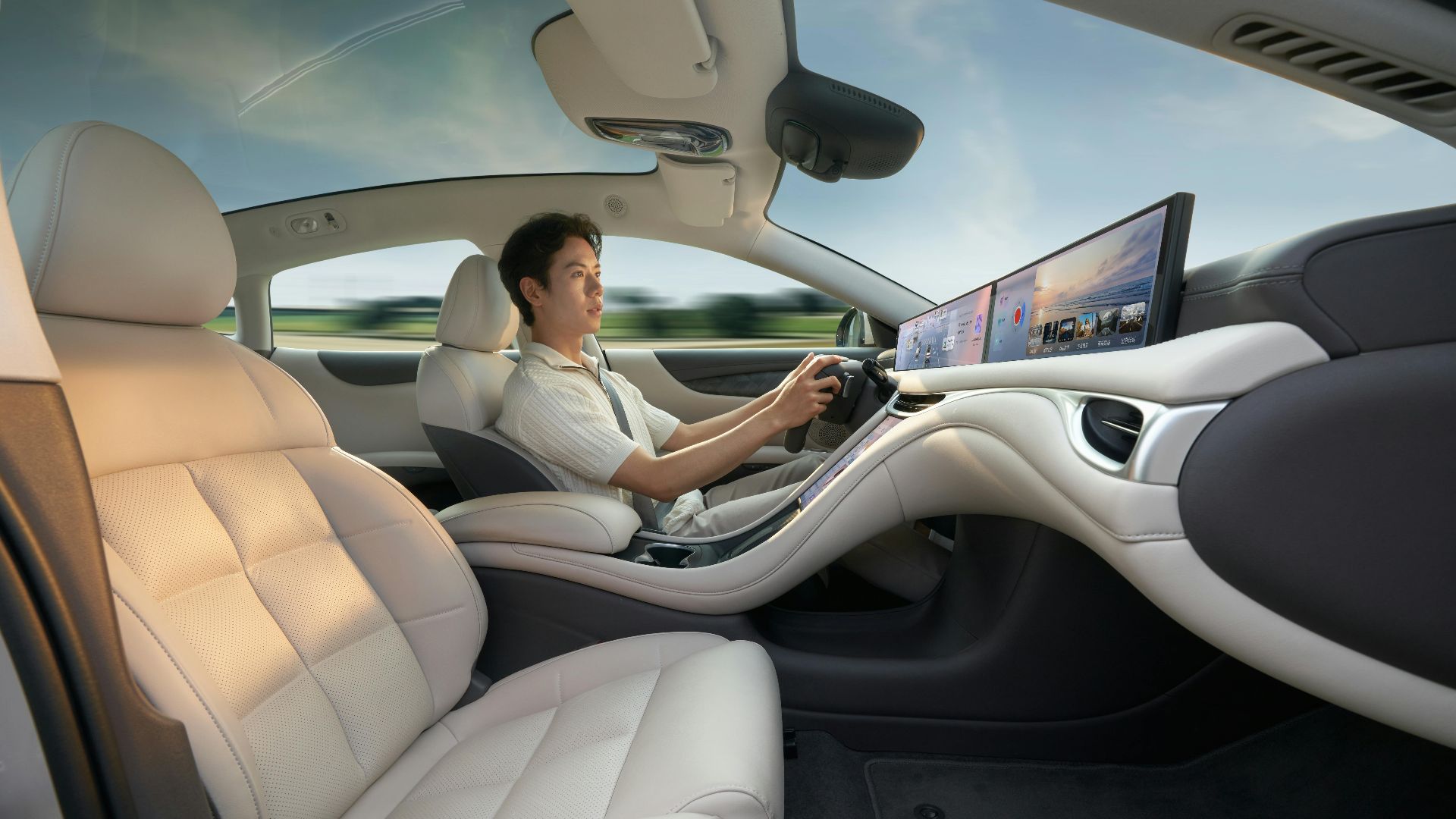 A modern electric car interior showcasing advanced technology with a driver enjoying a smooth ride.