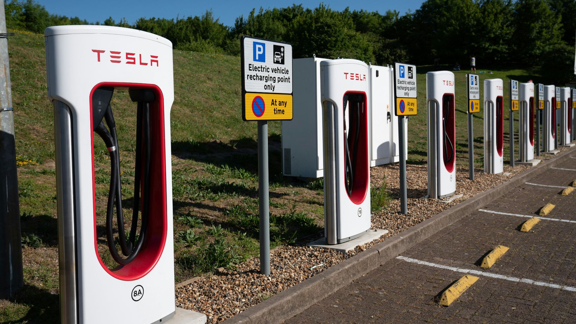 Tesla electric car charging stations in a row.
