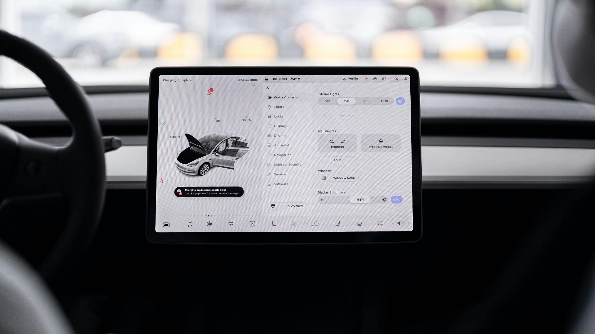 View of a modern car's dashboard featuring a digital display panel with control options.