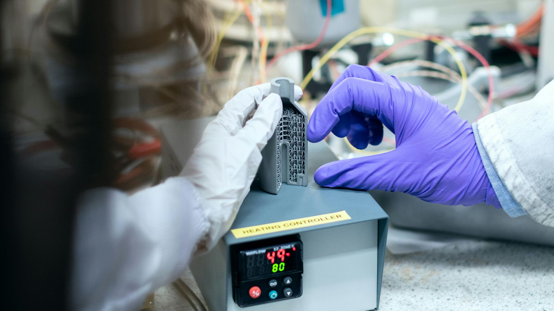 Scientist testing materials in a laboratory setting for clean energy solutions.