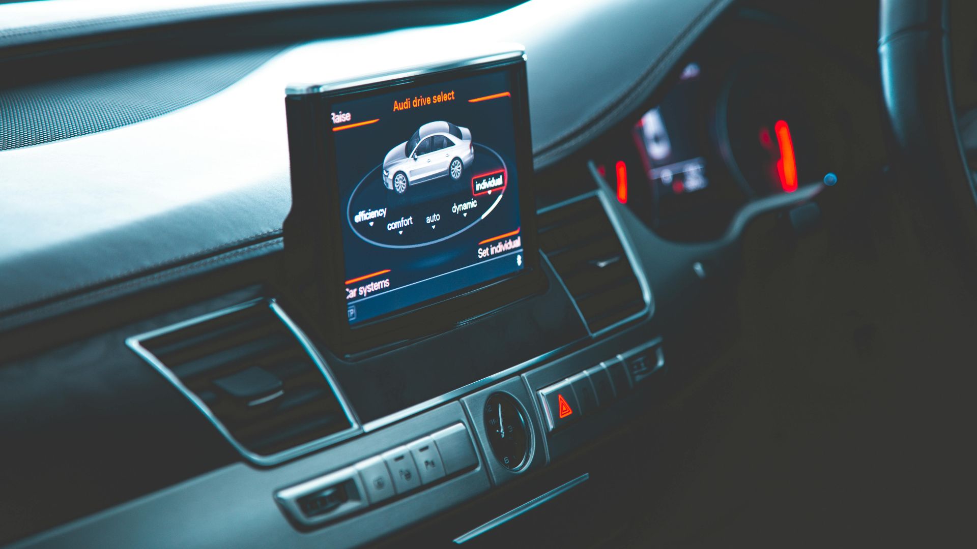 Close-up of a sleek Audi A8 interior highlighting the digital dashboard and multimedia display.