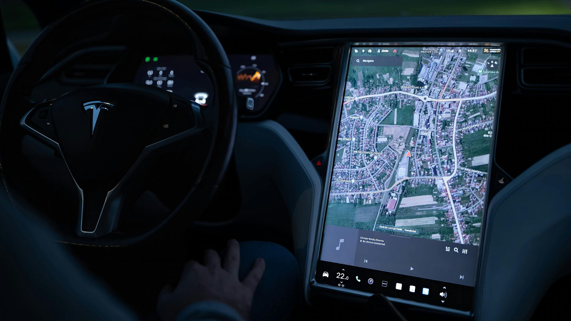 Explore the advanced touchscreen navigation in a modern electric vehicle's sleek interior at night.