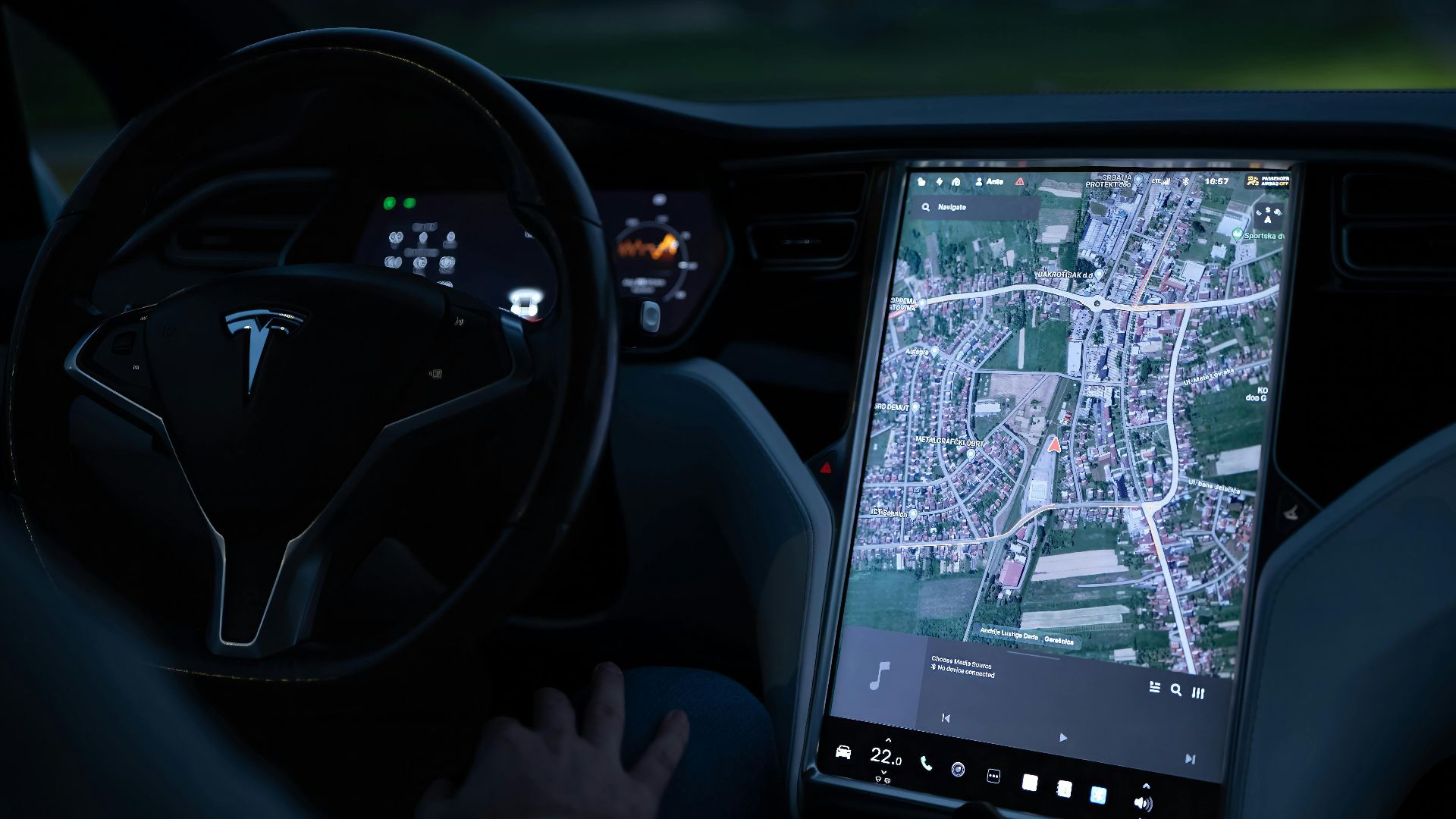 Explore the advanced touchscreen navigation in a modern electric vehicle's sleek interior at night.