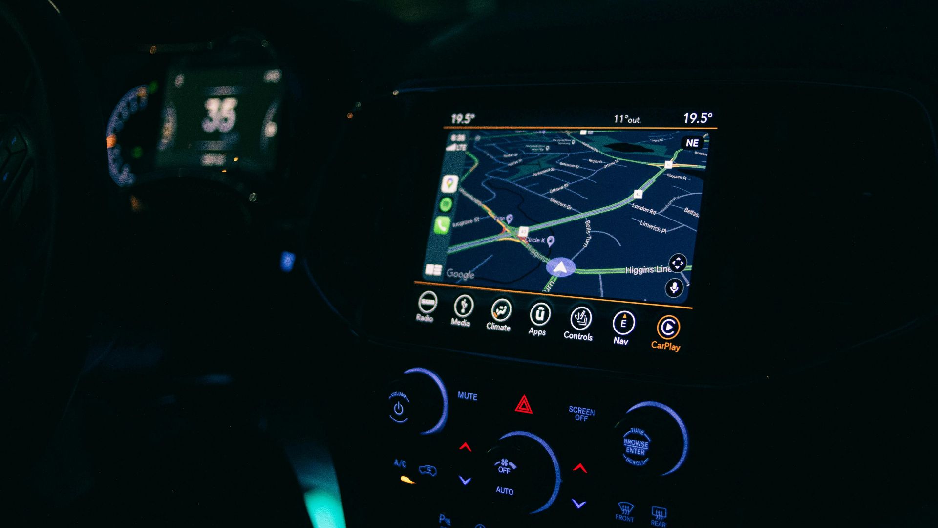 Interior view of a car featuring the GPS navigation system illuminated at night, showcasing technology and modern travel.