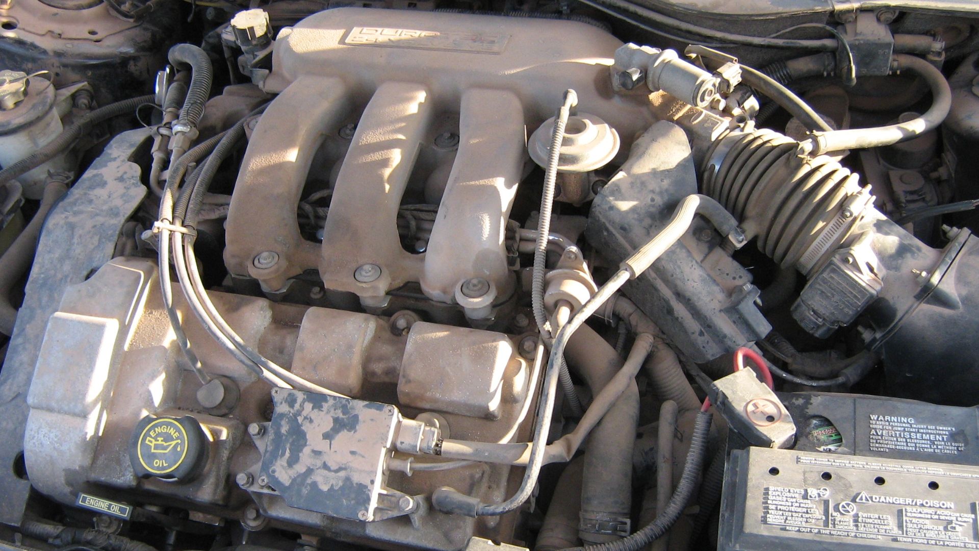 DOHC 3.0L V6. This is nasty. Its Arizona dirt baked right on. Its going to take a chisel to get off.