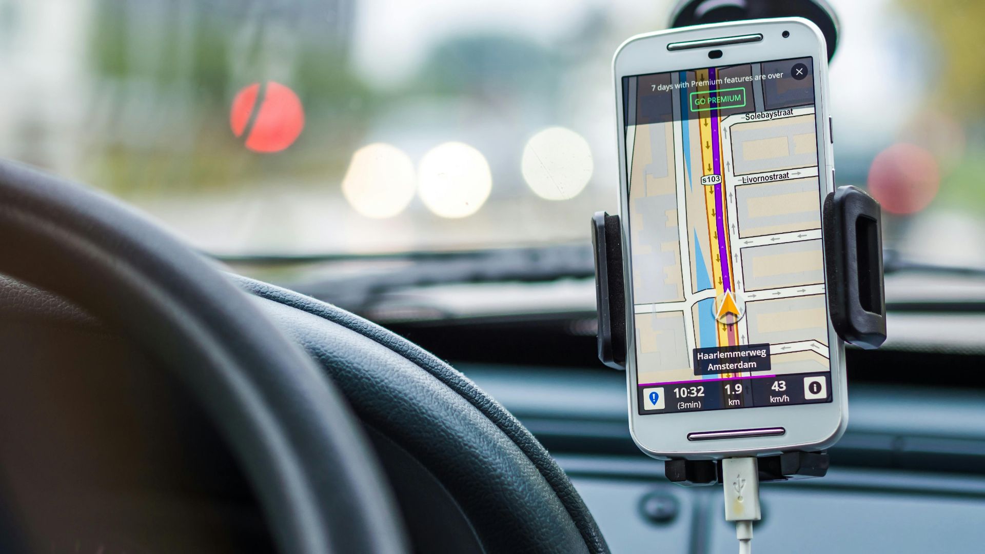 Smartphone mounted in car using GPS for navigation and directions.