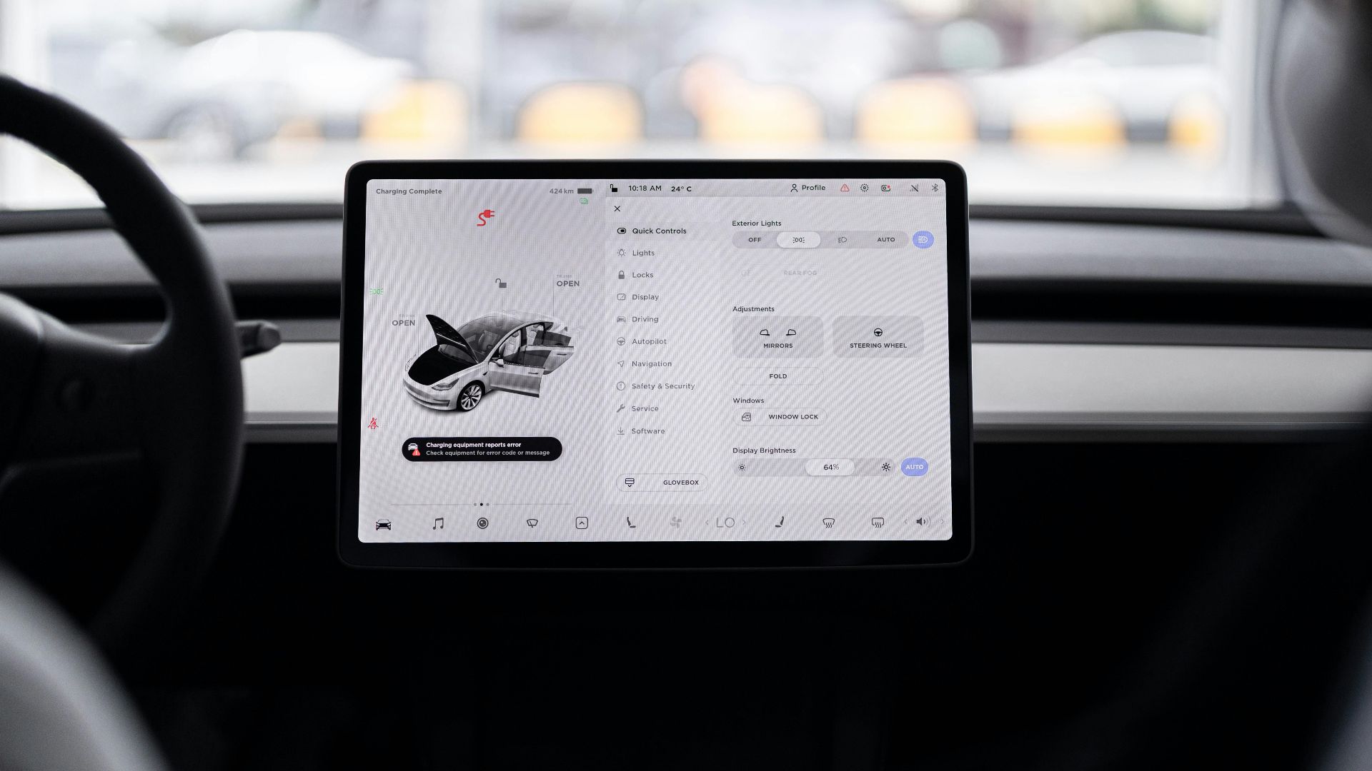 View of a modern car's dashboard featuring a digital display panel with control options.