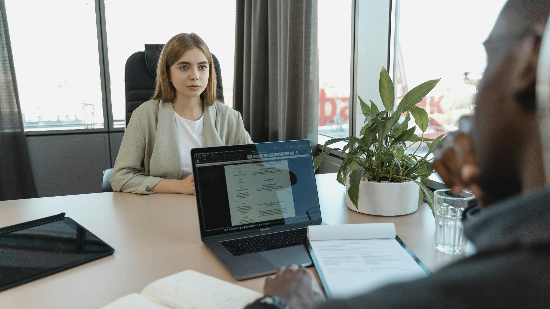 A professional job interview scene in a modern office setting, emphasizing recruitment and career opportunities.