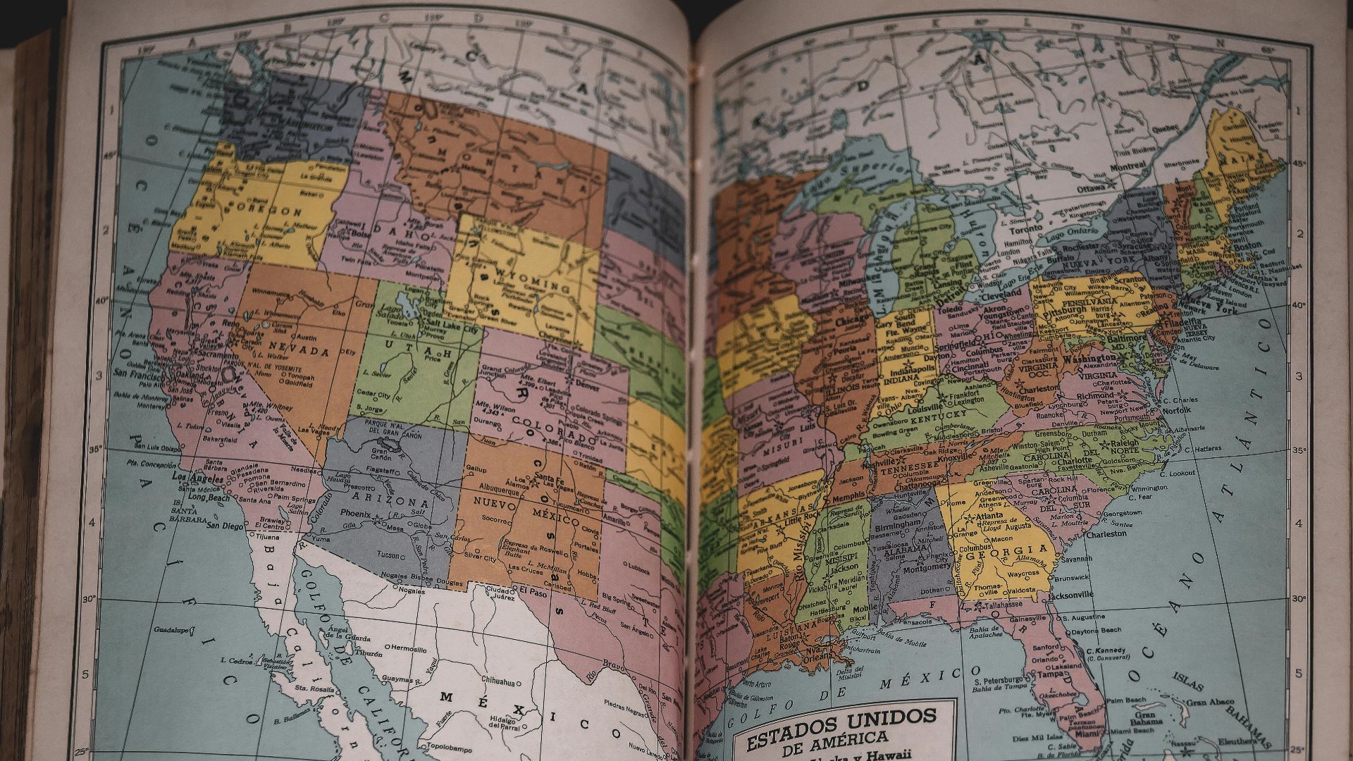 Classic vintage map of the United States in a historical book, showcasing detailed state borders.