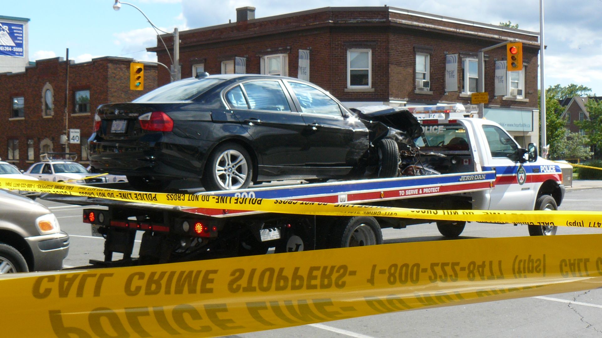 There has been a horrendous car accident just steps away from our house. At around 2 pm on 2008-07-14, apparently a black BMW was going west on Danforth Avenue (east of Coxwell Avenue) and had a very minor fender-bender collision with another car.  For so