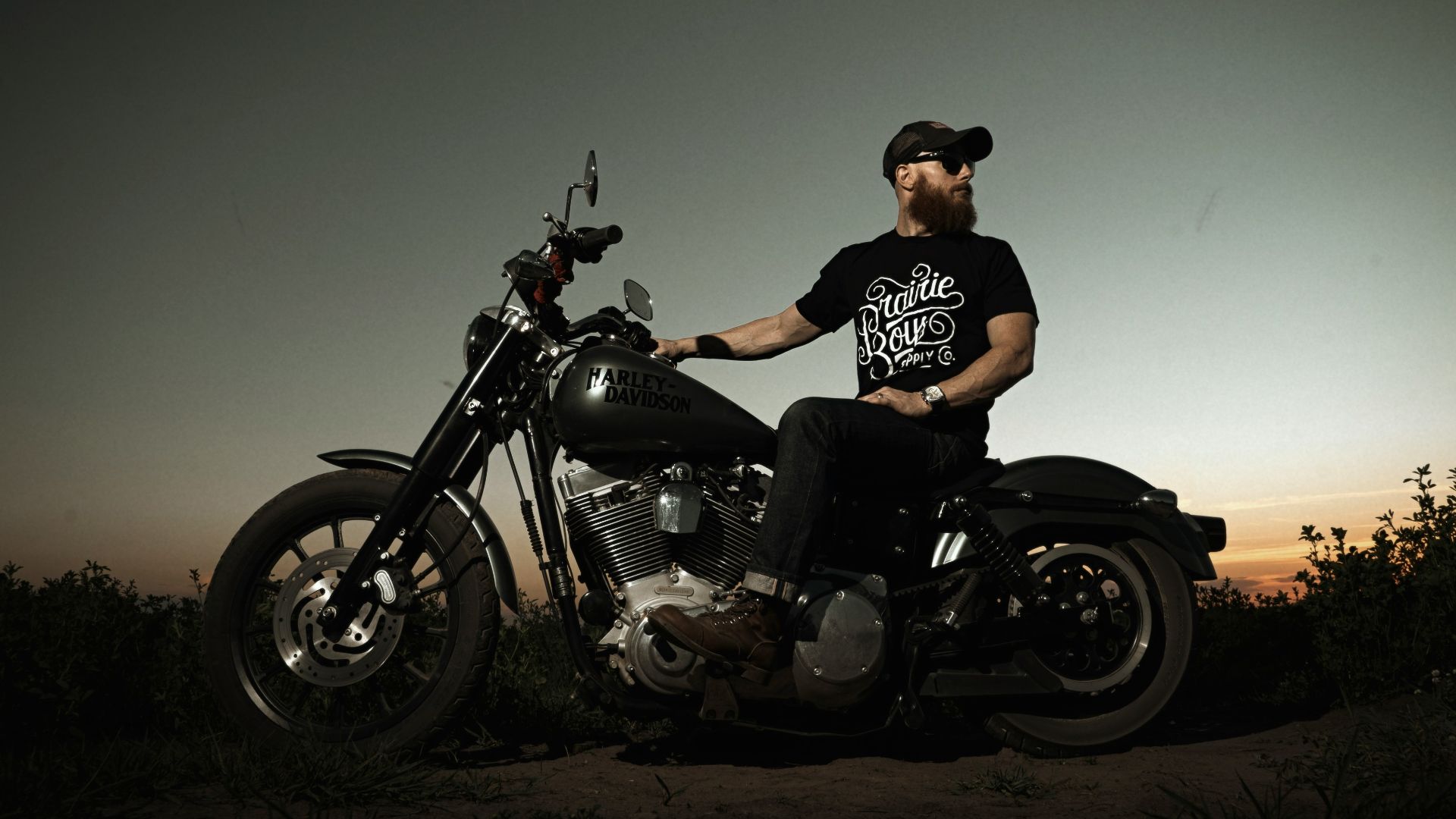 man in black t-shirt riding motorcycle