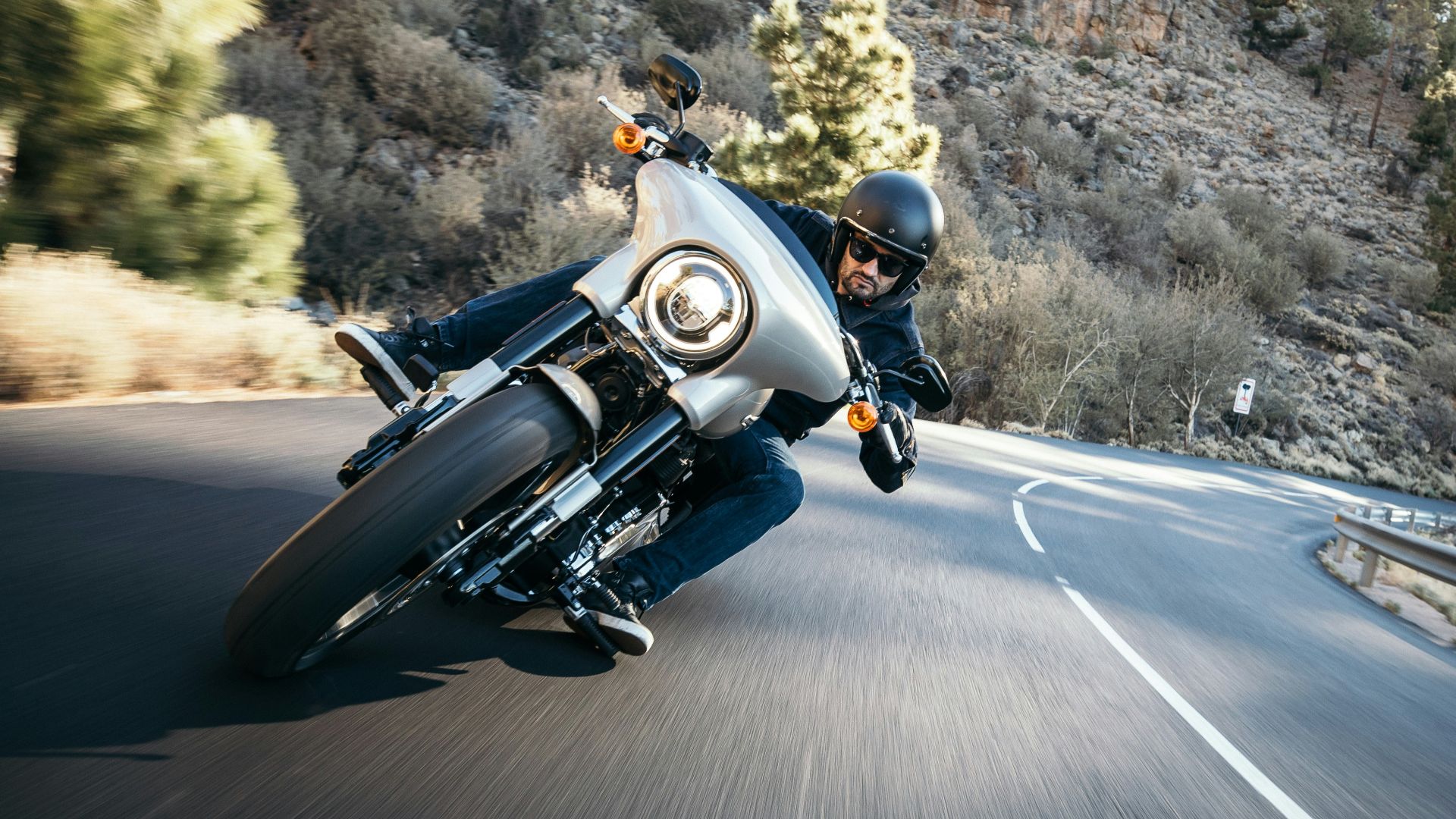 man riding motorcycle at the road during daytime