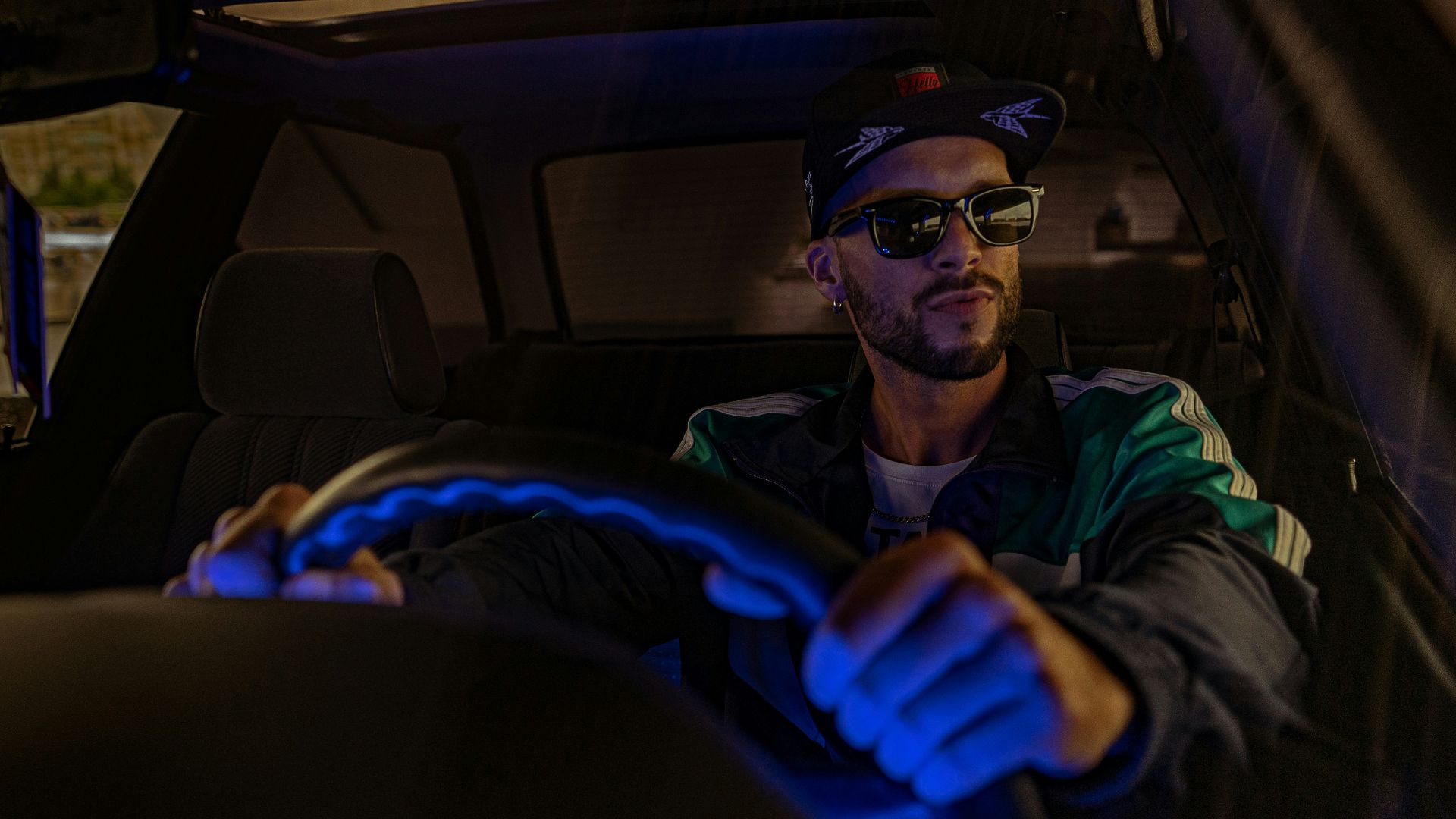 man in black jacket wearing black sunglasses