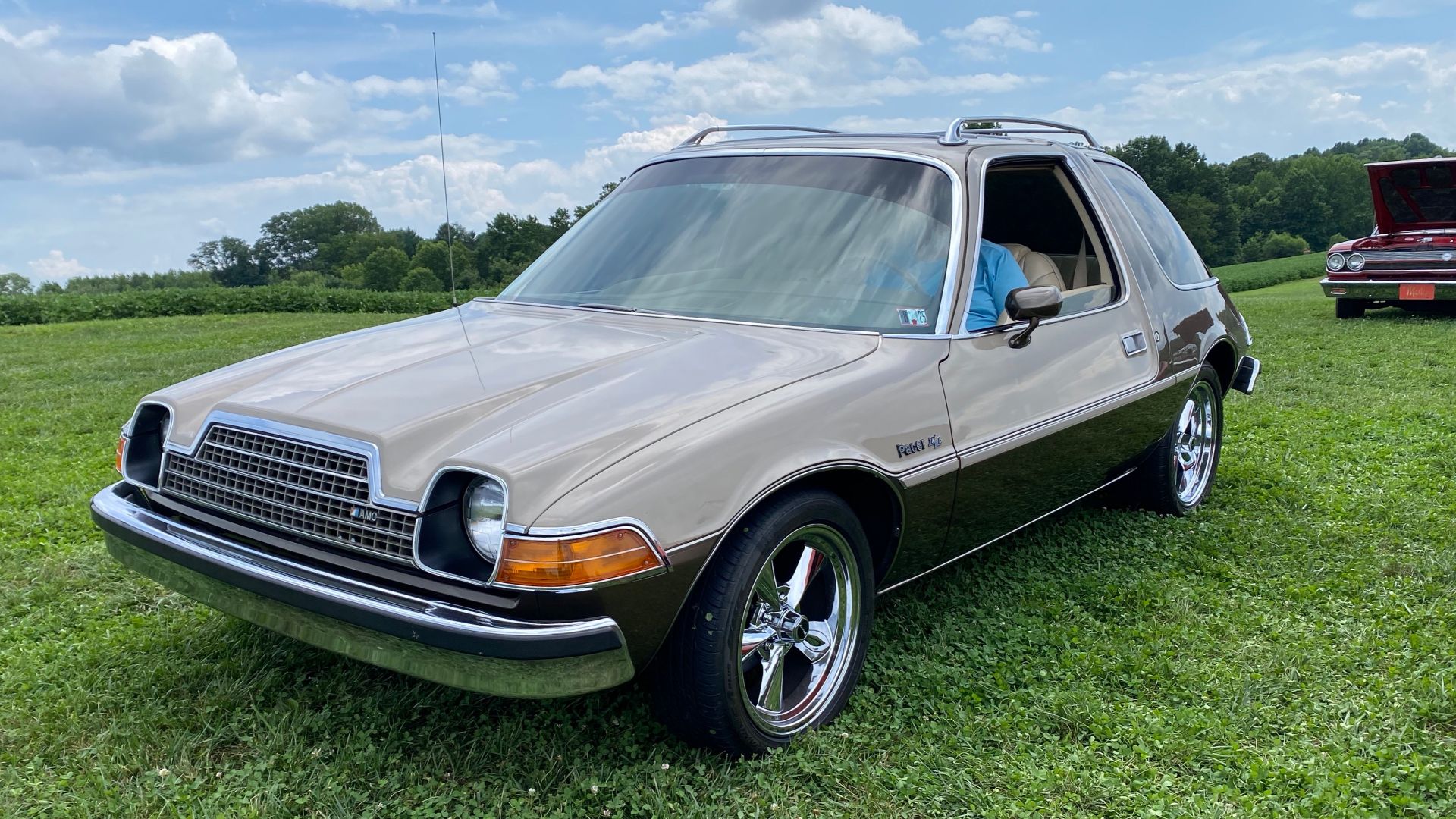 1978 AMC Pacer D/L coupe made by American Motors Corporation (AMC). This car is finished in factory two-tone Khaki and British Bronze and has a matching original interior color and upholstery with the standard individually adjustable and reclining front s