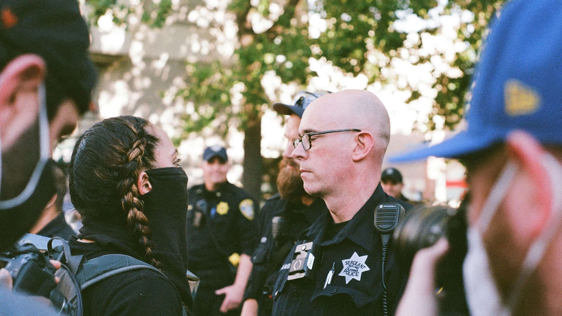 man in black polo shirt wearing eyeglasses
