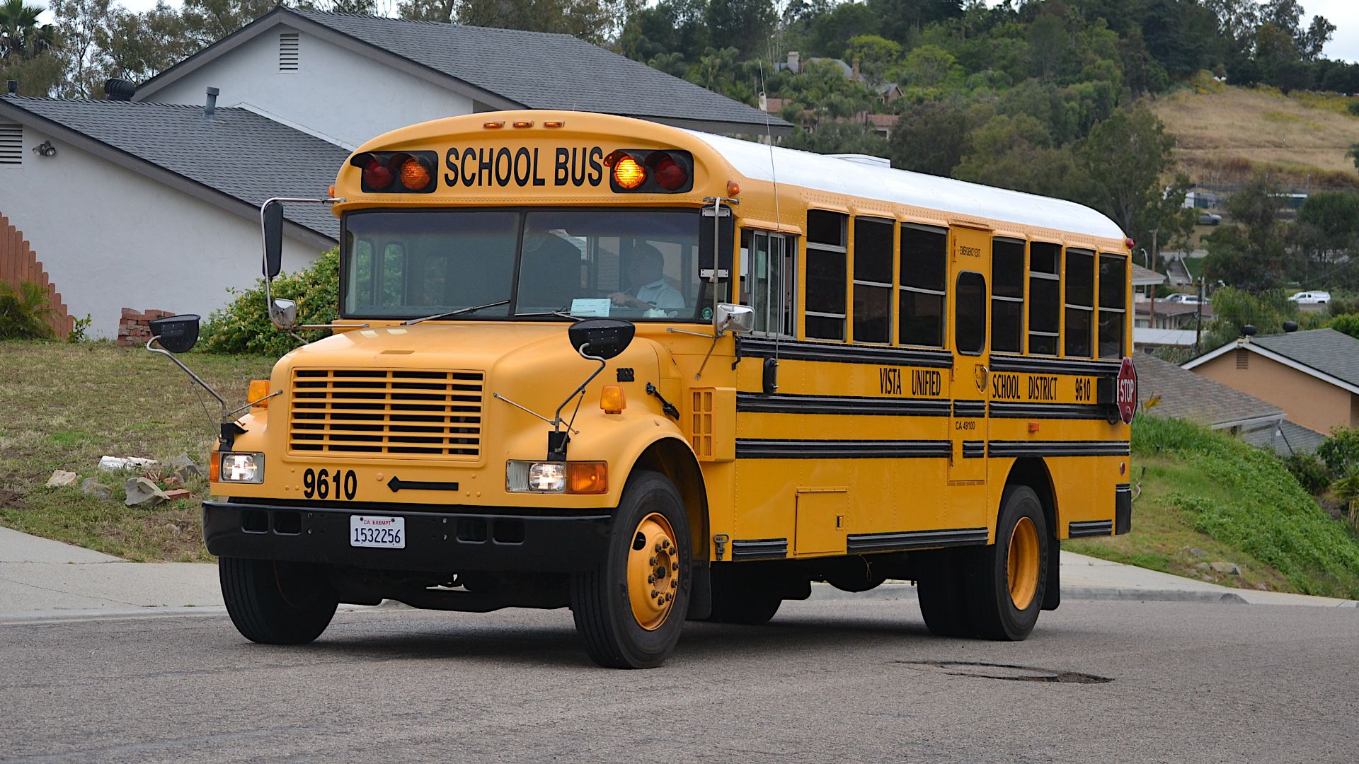1996 Blue Bird conventional school bus on an International 3800 chassis in Vista, California (Vista Unified School District no. 9610).