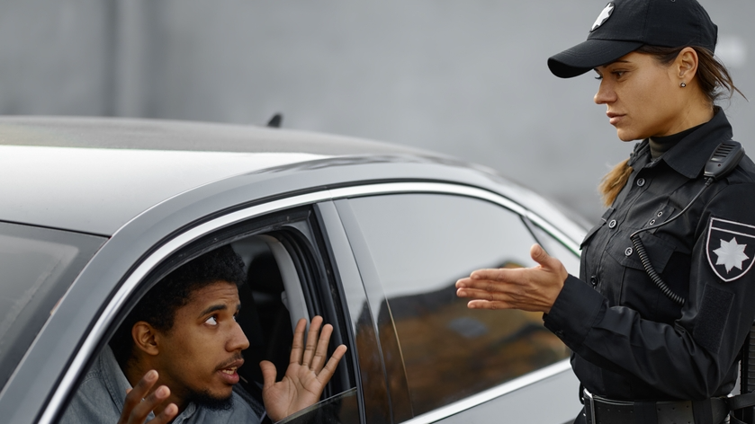 Car driver arguing with traffic police woman