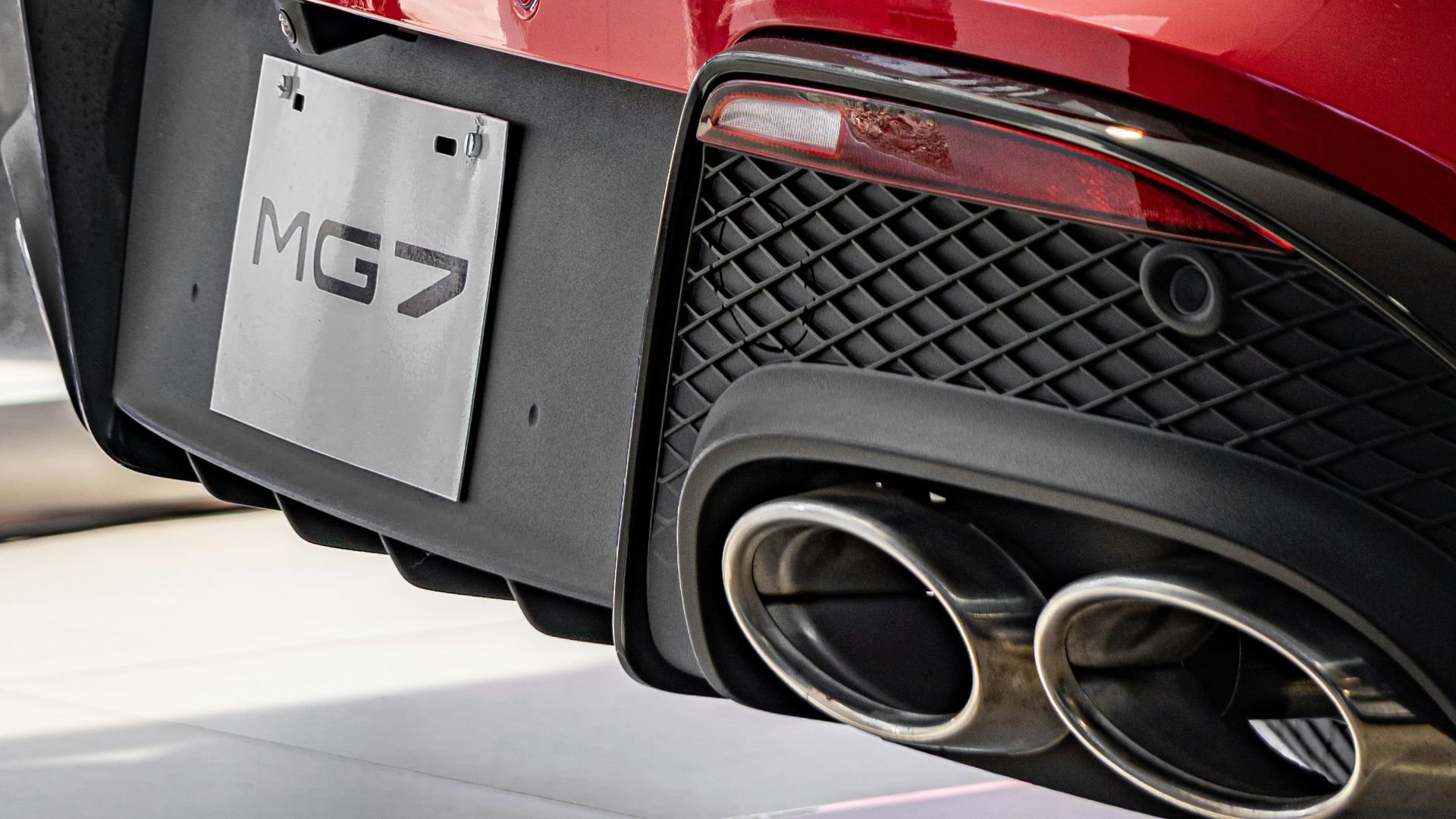 Rear view of a shiny red mg7 car