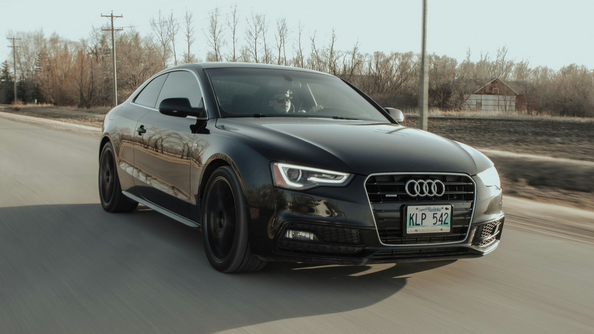 black audi coupe on road during daytime