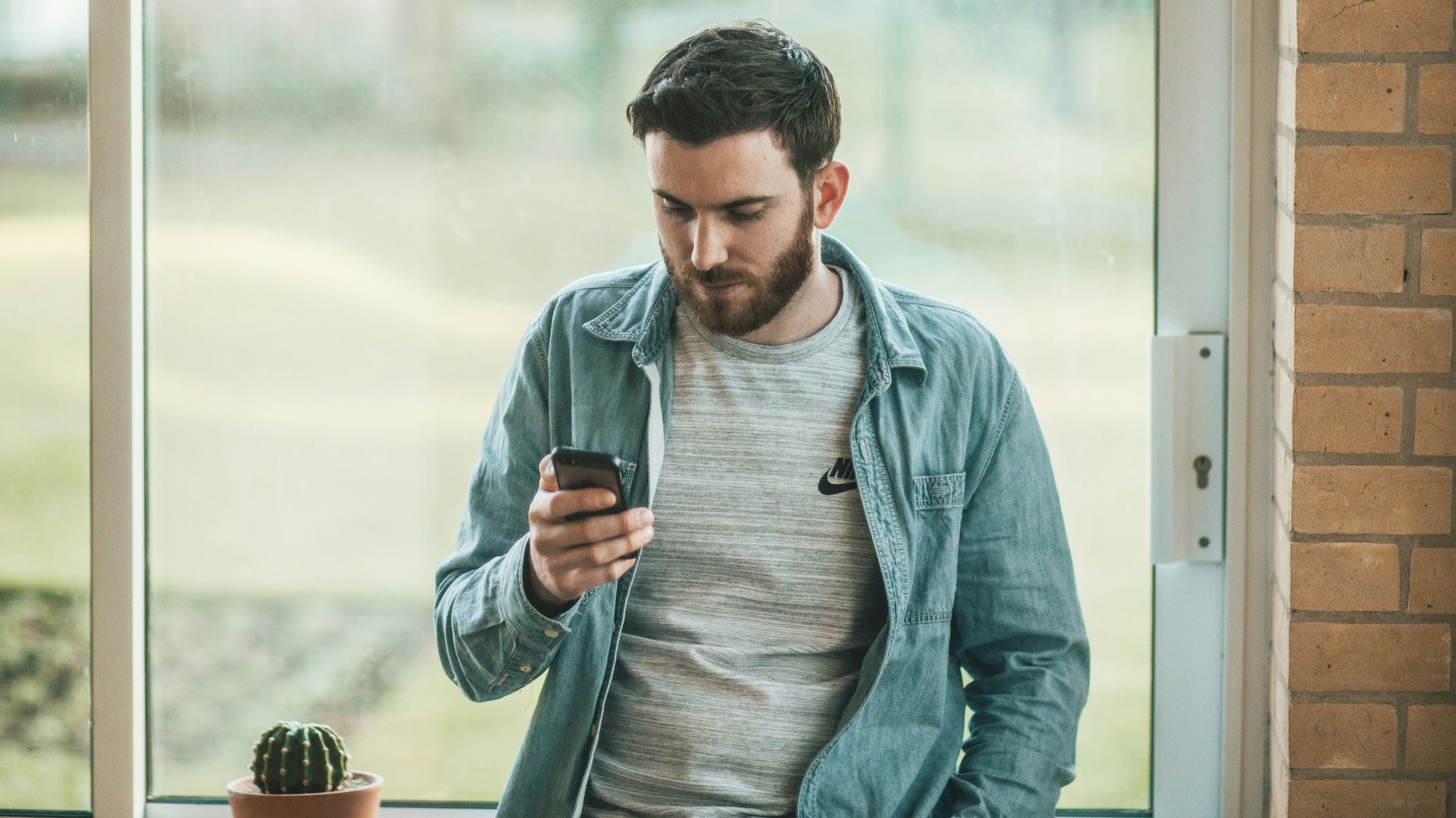 man using his smartphone