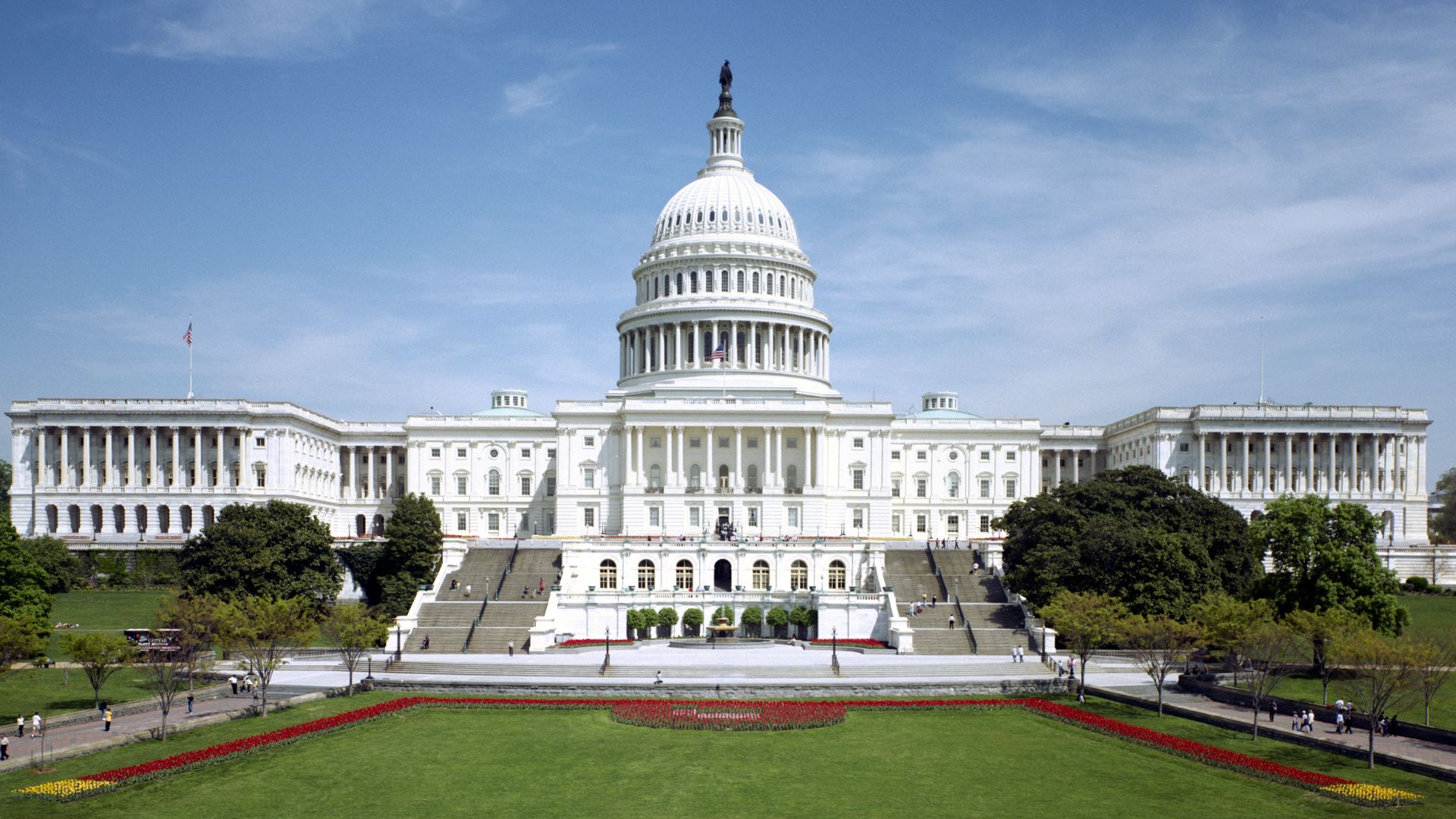 The western front of the United States Capitol. The Neoclassical style building is in Washington, D.C., on Capitol Hill, at the east end of the National Mall. The Capitol was designated a National Historic Landmark in 1960.