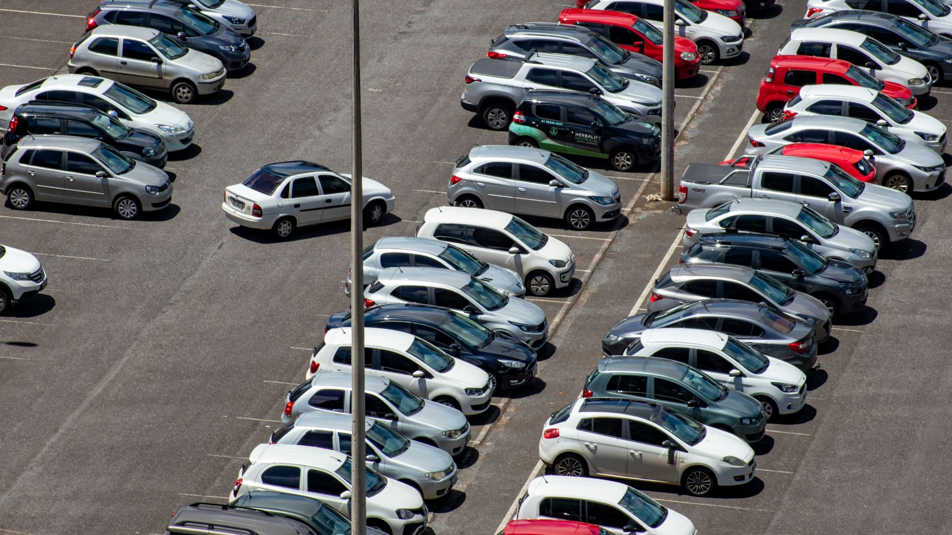 cars parked on parking lot during daytime
