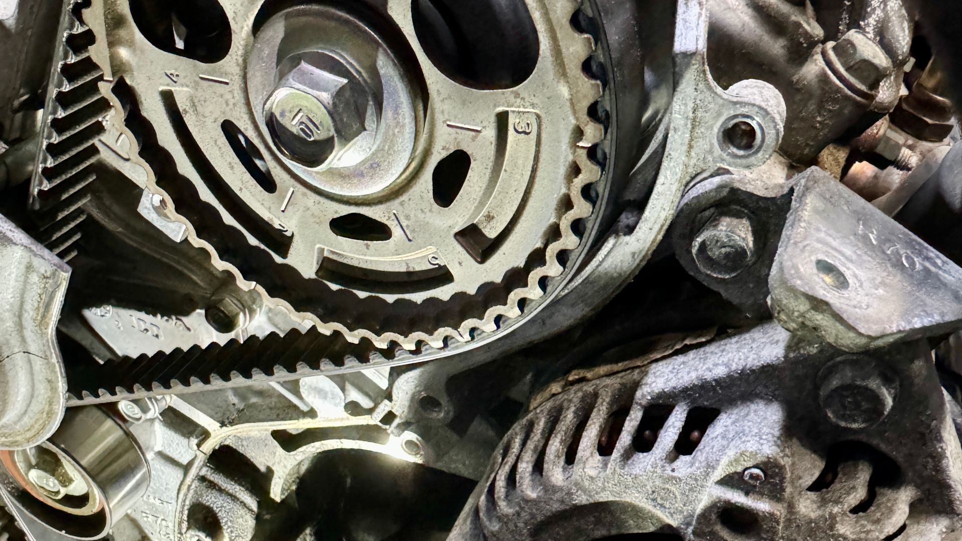 A toothed rubber timing belt, also known as a synchronous belt, is a crucial component in an internal combustion engine. It is made of durable rubber and features teeth on its inner surface that mesh with corresponding grooves on the crankshaft and camshaft pulleys. These teeth ensure precise synchronization between the rotation of the crankshaft and camshaft, which is essential for the correct timing of the engine’s valves in relation to the movement of the pistons.