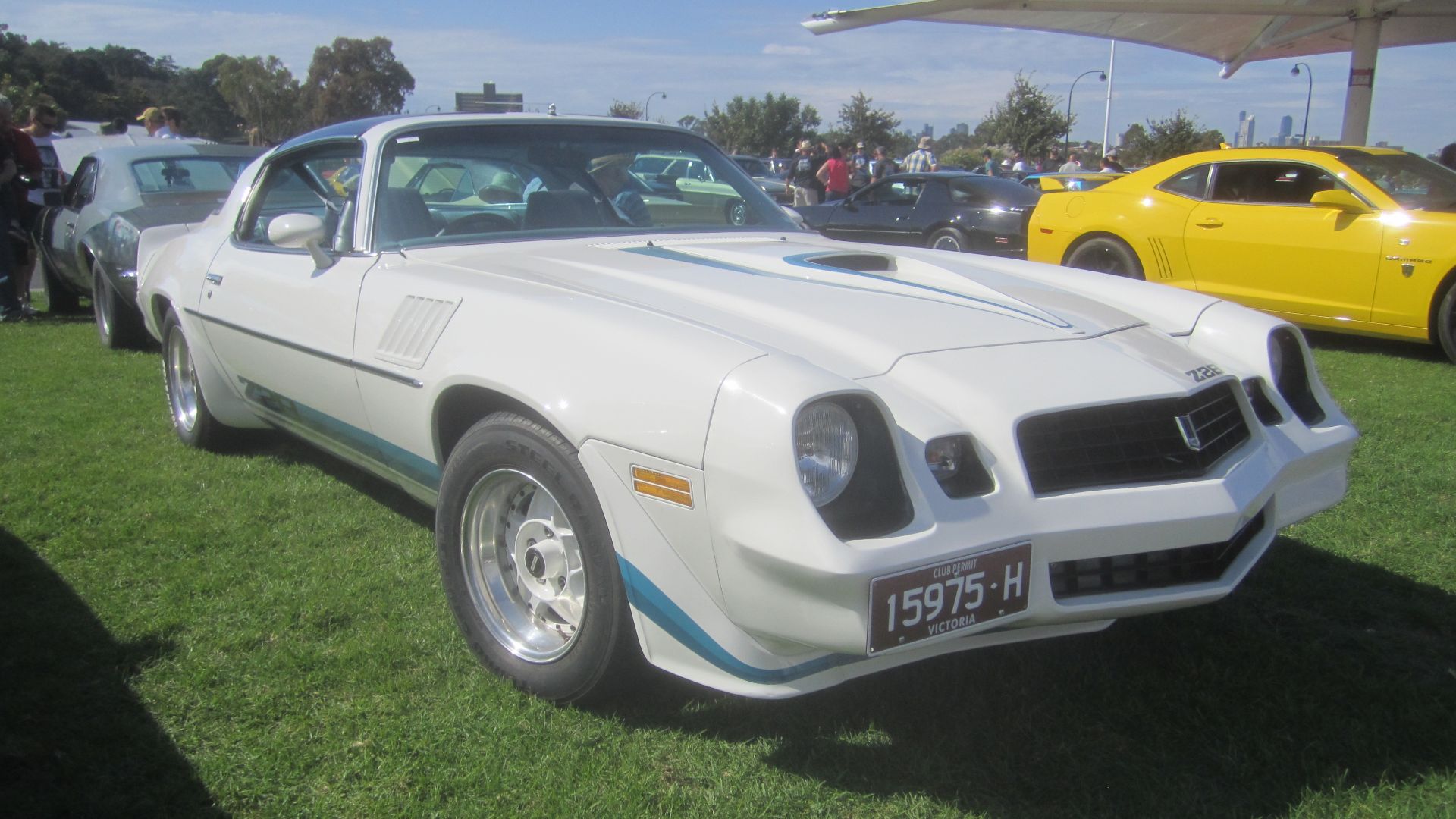 White. 
1974 saw the 2nd generation Camaro get a facelift, now longer, thanks to a new nose, with forward sloping grille. 
A wrap around rear window was introduced in 1975. 
The Z28 was reintroduced in 1977
1978 saw the front bumper integrated into the nose of the car
In 1979 a front spoiler and fender flares were added. Models available this year were; base coupe, Rally Sport, Berlinetta, and Z28

Z28 engine; 185hp 350 V8