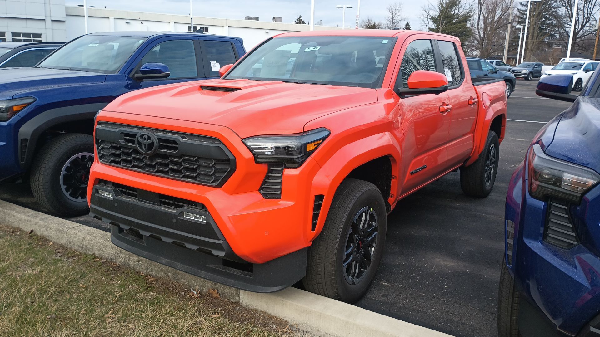 Front view of a 2024 Toyota Tacoma TRD Sport Double Cab midsize pickup truck.