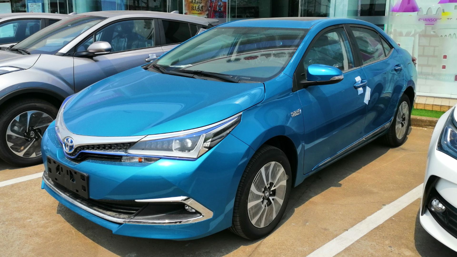 Toyota Corolla E180 Hybrid E+ sedan photographed in Shanghai, China.