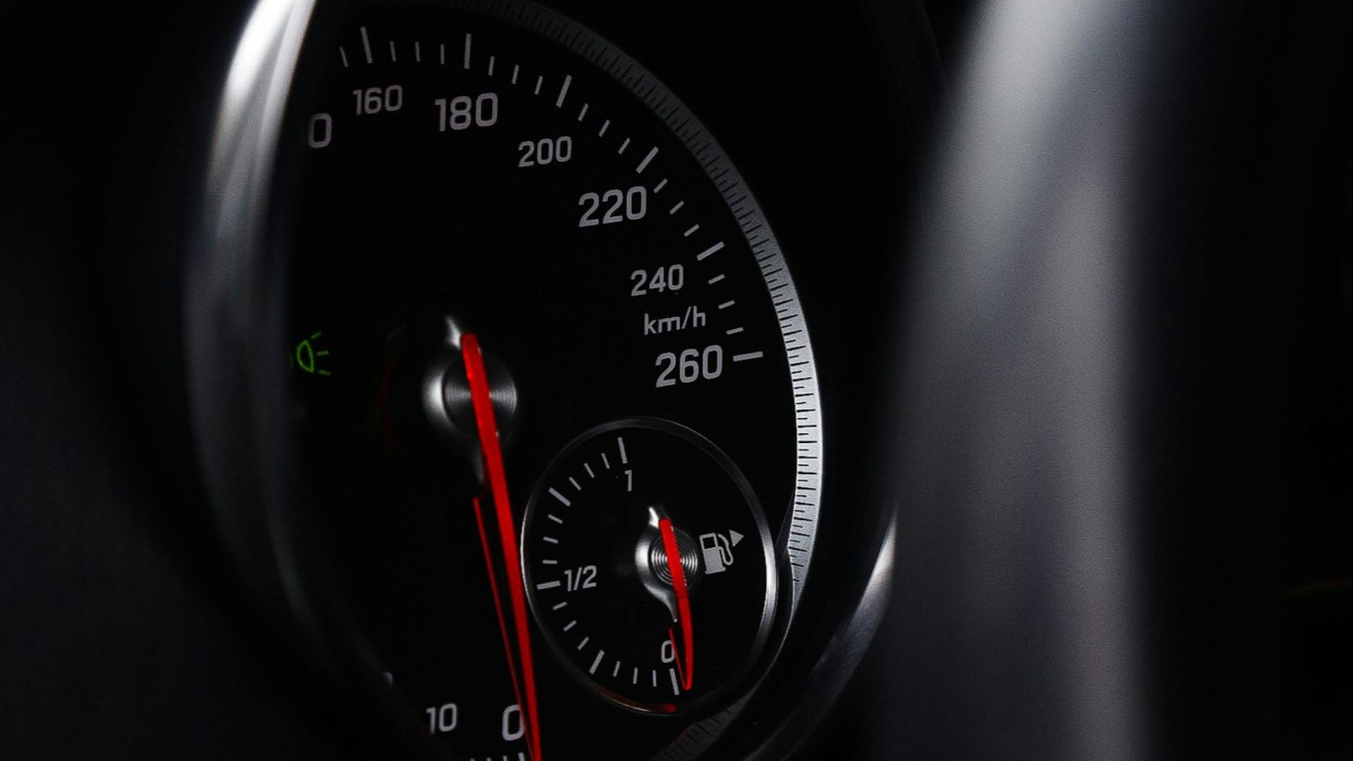 Detailed image of a car speedometer and dashboard showcasing vehicle speed and fuel gauge.