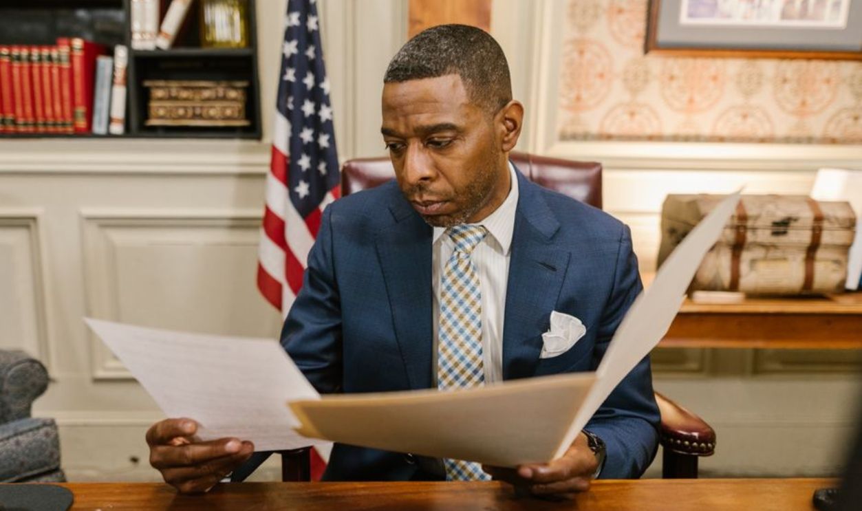 A lawyer reading documents in an office setting, conveying professionalism and focus