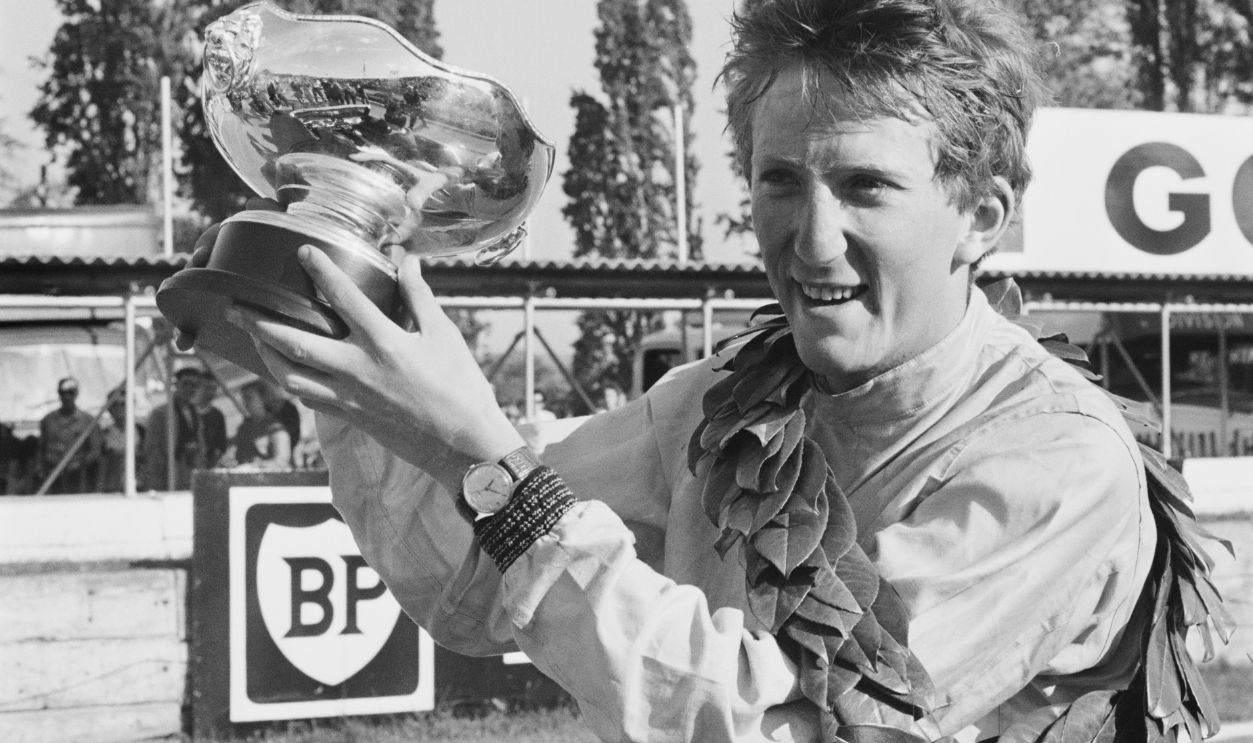 German racing driver Jochen Rindt (1942 - 1970) holding his trophy after winning the 'London Trophy' Formula 2 race at the Crystal Palace circuit, UK, 18th May 1964.