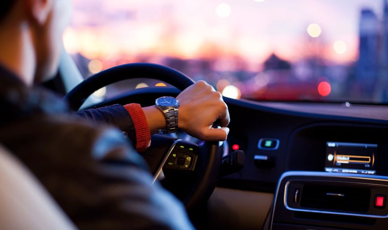 Hand on steering wheel