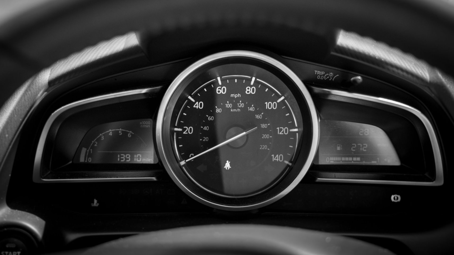 black and white car speedometer