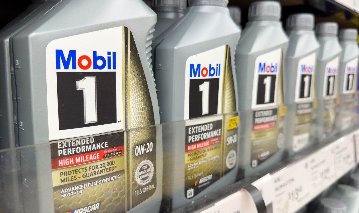 Los Angeles, CA - April 11, 2023: Selective focus of Mobil 1 motor vehicle engine oil quarts on a shelf.