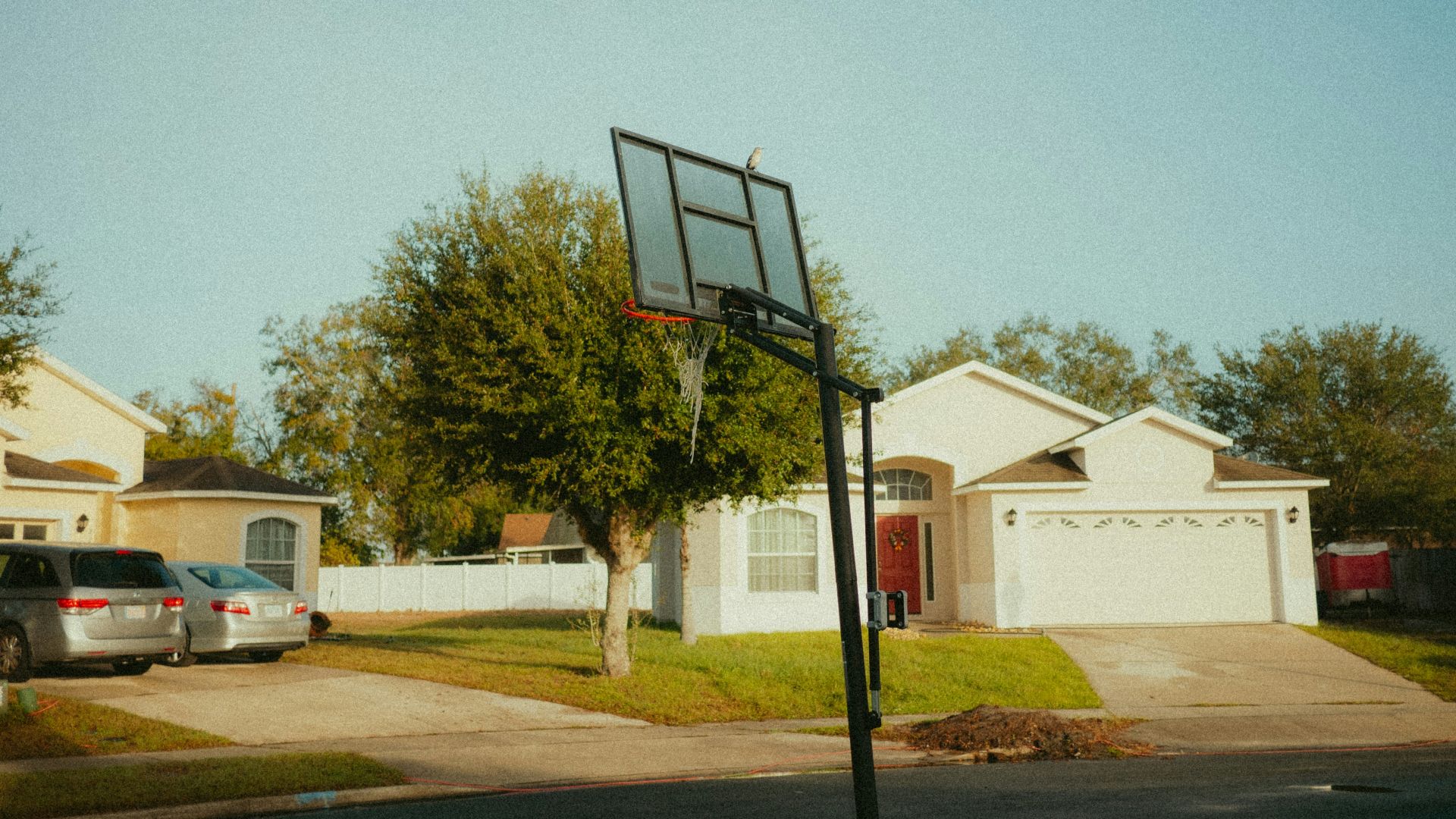 A basketball hoop in front of a house