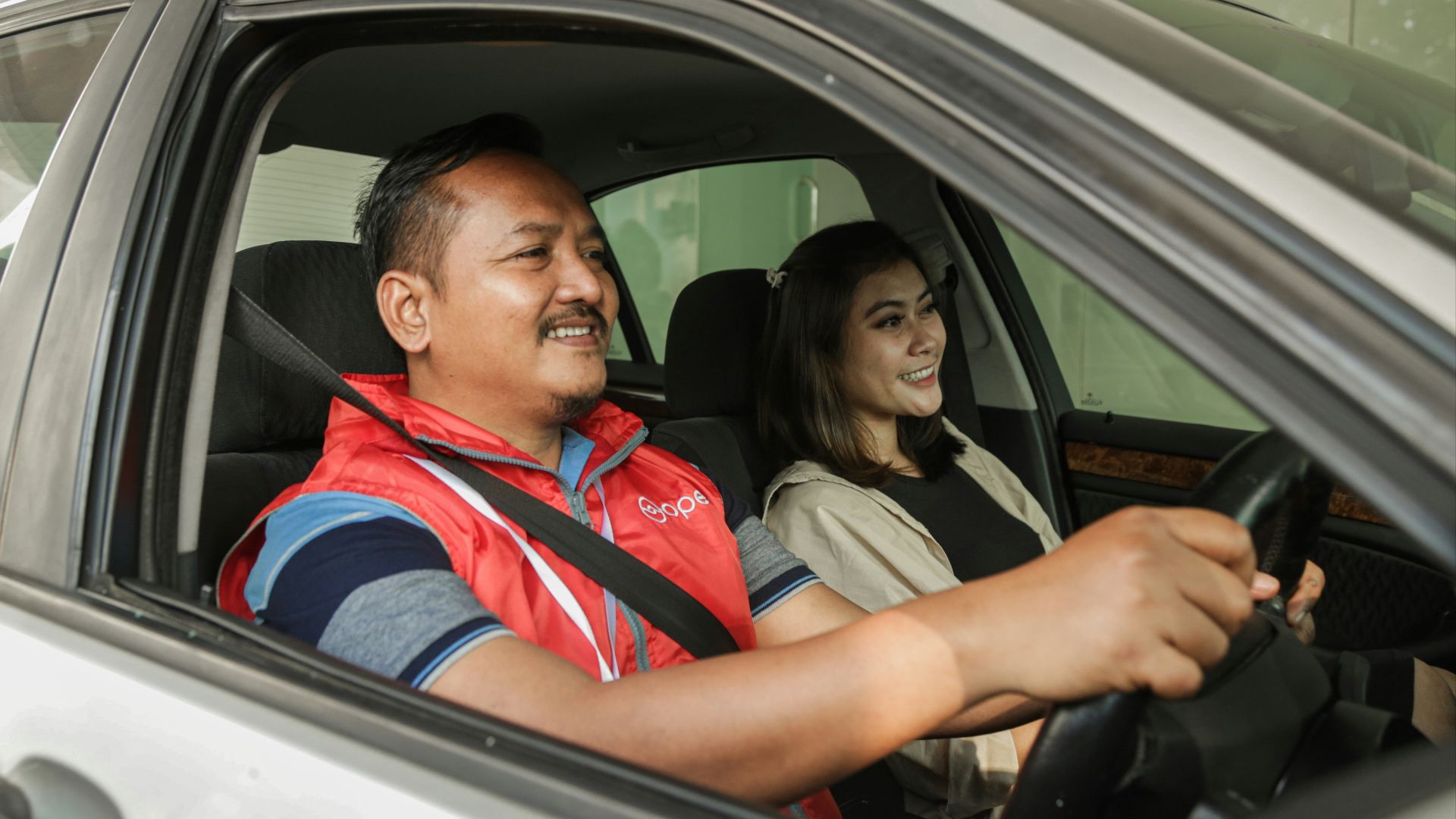 a man and woman in a car