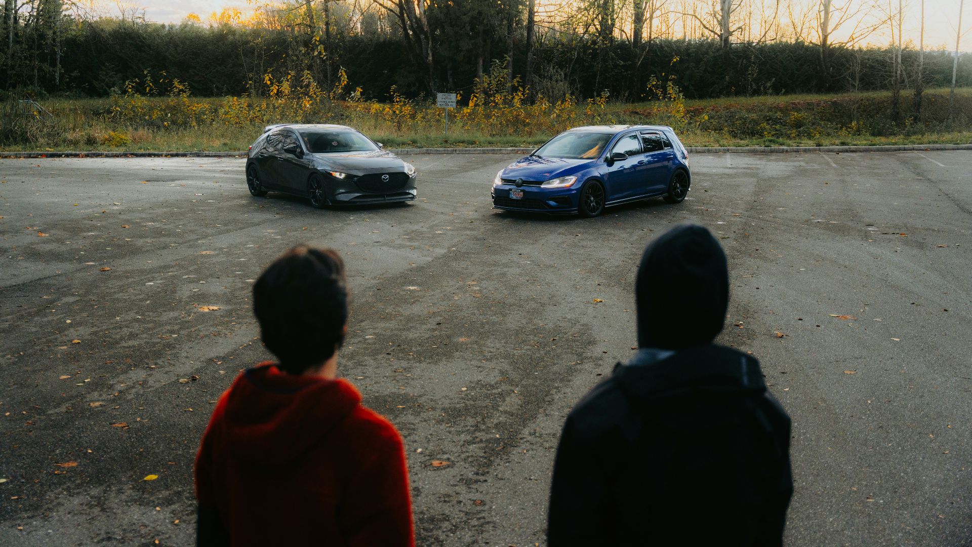 A group of people standing in a parking lot