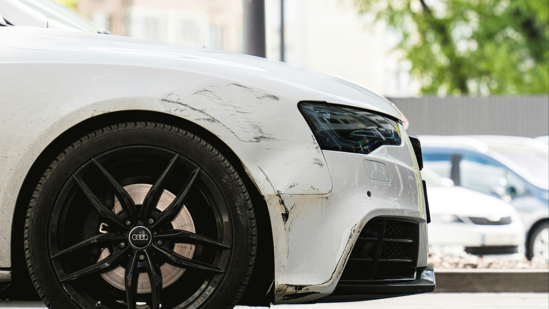 a white car parked on the side of the road