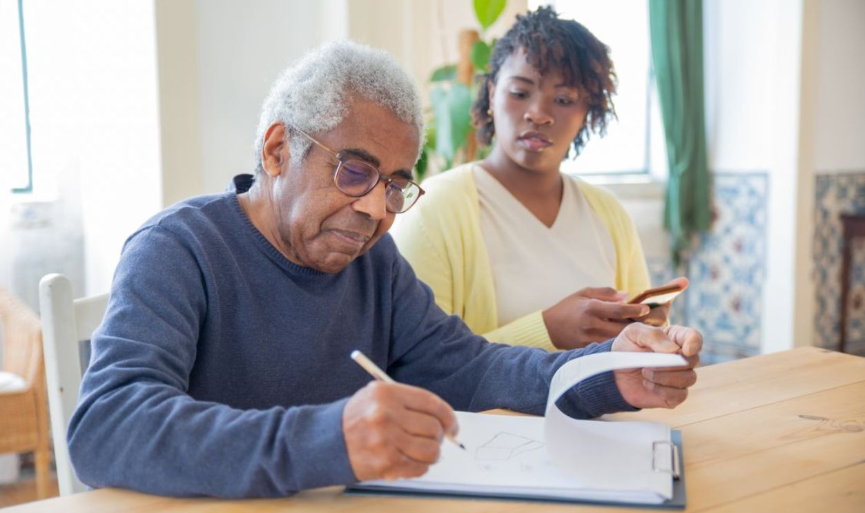 parent and teenager reviewing insurance options
