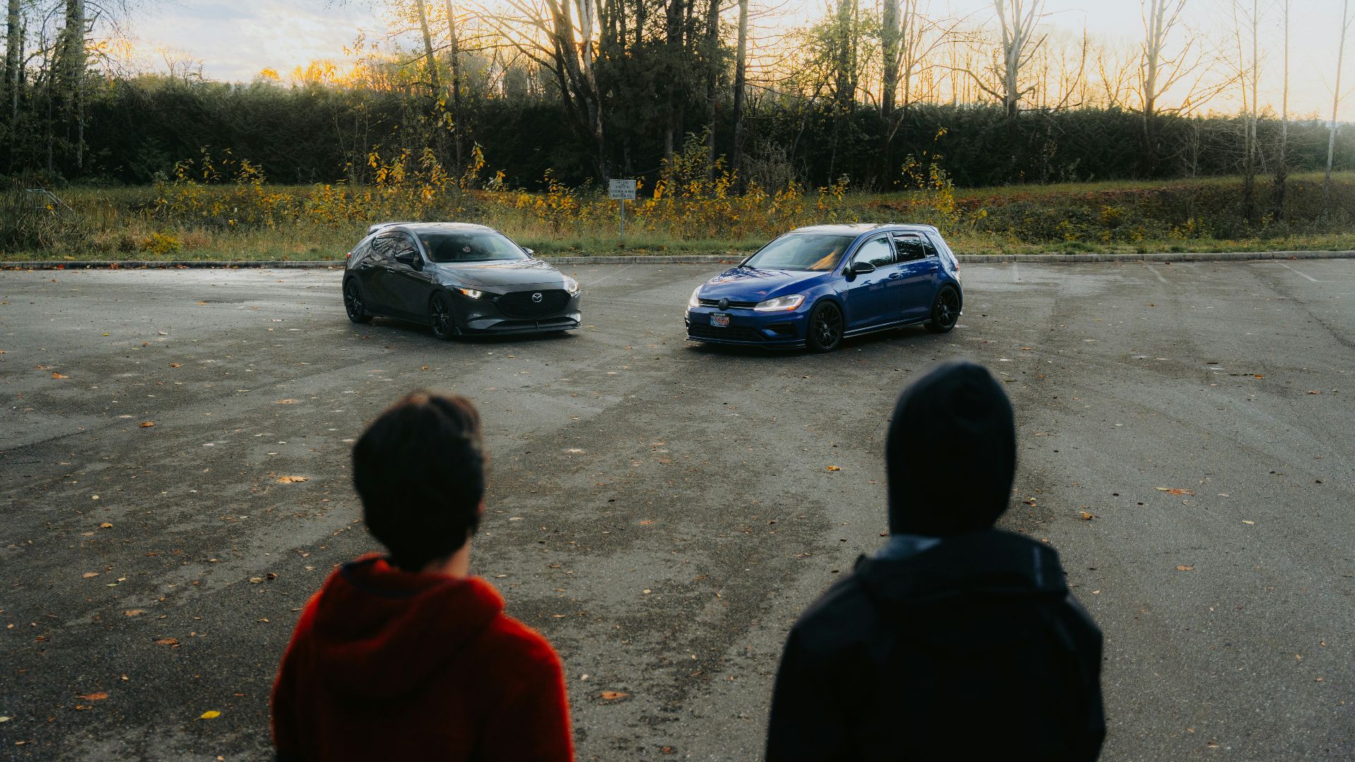A group of people standing in a parking lot