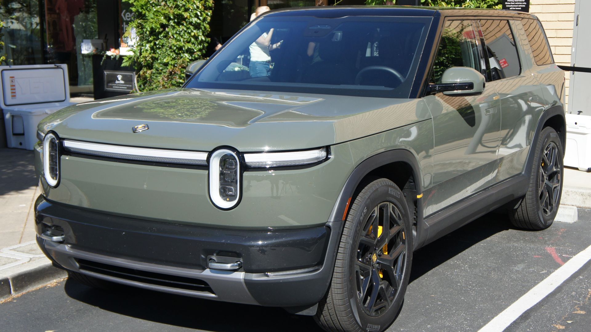 Rivian R2 in Launch Green parked outside Rivian Space in Stanford Shopping Center in Palo Alto, CA