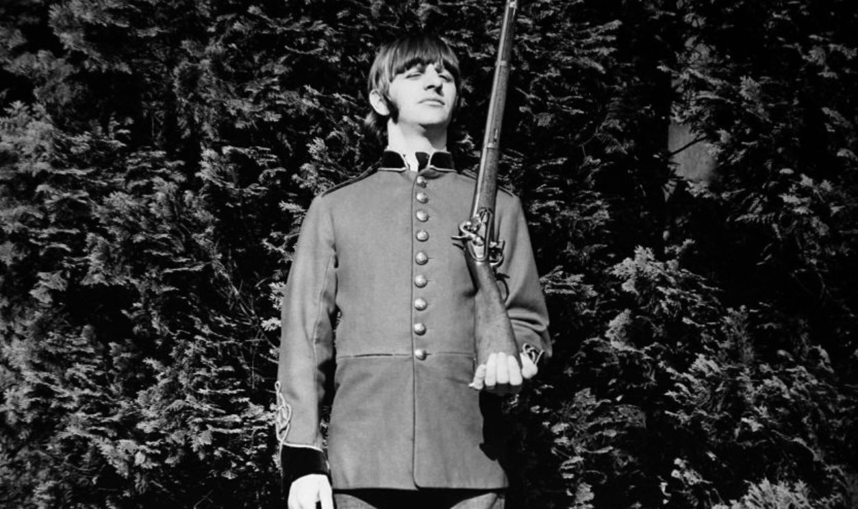 UNITED KINGDOM - CIRCA 1960: Ringo Starr looks very smart with his army jacket and his gun, in the United Kingdom, circa 1960.
