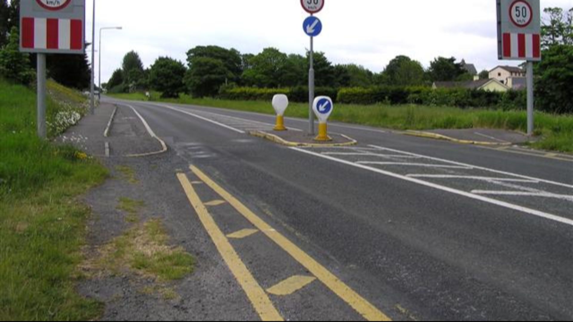 Road at Ballincar Heading east towards Sligo.  There is cycle lanes on either side of the road.