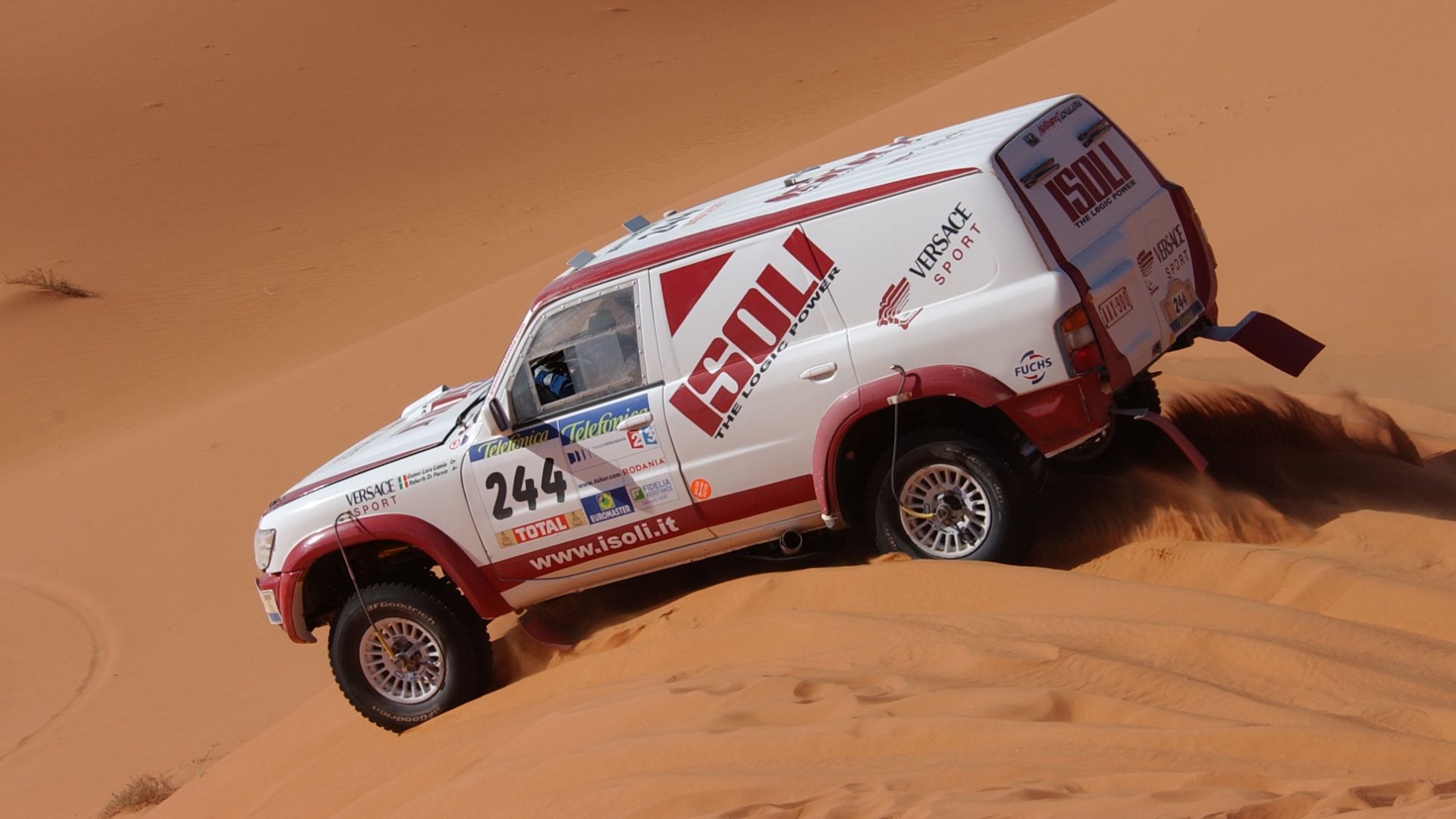 Gianni Lora Lamia and his Nissan Patrol GR Y61 4.5L Carbon Body of the team Versace Sport Nissan Promotech Rally Raid during the Dakar Rally 2003, special stage El Borma-Ghadames Tunisia/Libya January 7, 2003