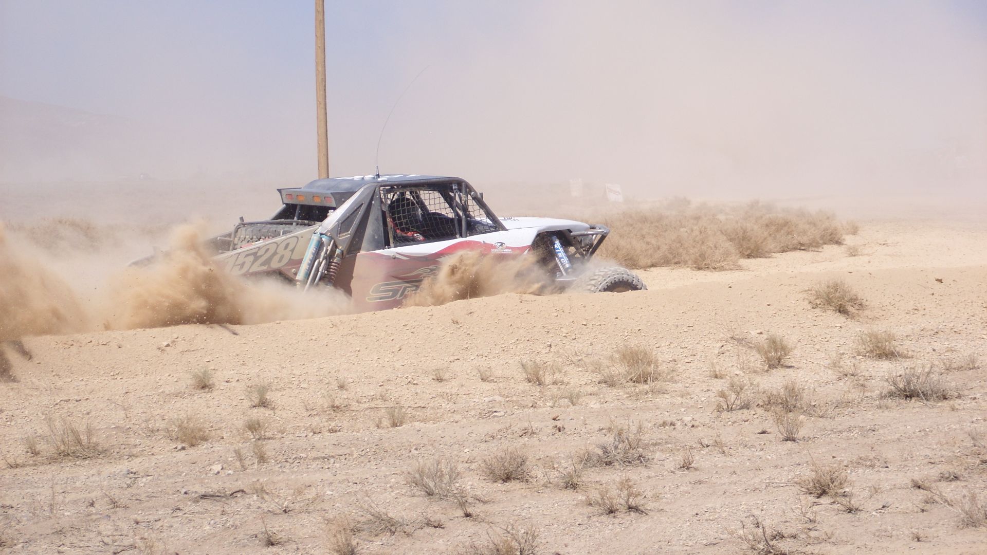 The #1528 Class 1 Speed Technologies buggy blows through the Cotton Tail pit at the 2008 Vegas to Reno. Boy Scout Venture Crew 35 is going to rebuild a Ford Ranger to race in SCORE's Baja 1000 and Best In The Desert's (BITD) Vegas to Reno. Check out the p