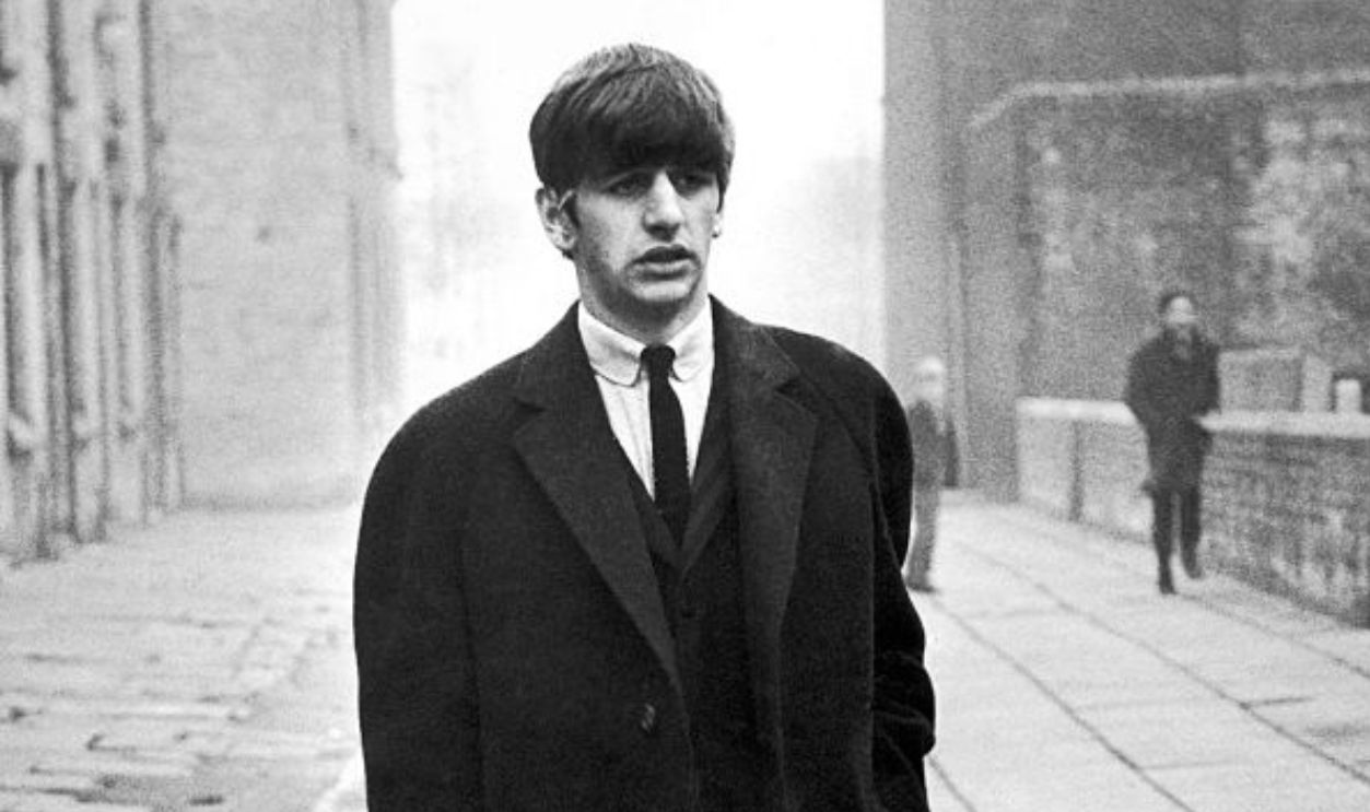 Beatles Drummer Ringo Starr pictured leaving his family home in Admiral Grove Liverpool, 7th December 1963. Ringo is on his way to the Empire Theatre, where a special edition of the BBC television show Juke Box Jury will be filmed / taped.