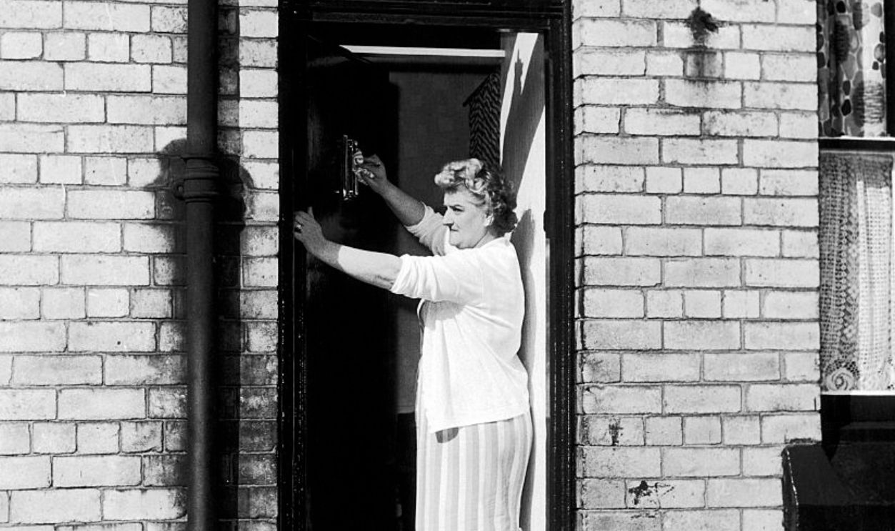Elsie Starkey, mother of Ringo Starr, July 1964. Pictured polishing door knocker at No. 10 Admiral Grove, Liverpool. A.k.a. Elsie Gleave Elsie Grave