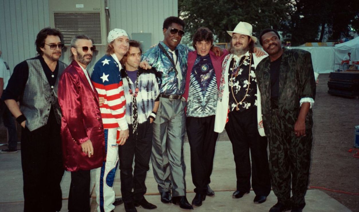 ST. PAUL, MN - 1989: Ringo Starr and His All Star Band (L-R) Jim Keltner, Ringo Starr, Joe Walsh, Nils Lofgren, Clarence Clemons, Rick Danko, Dr. John and Billy Preston, pose for a portrait backstage at Riverfest in St. Paul, Minnesota in 1989.